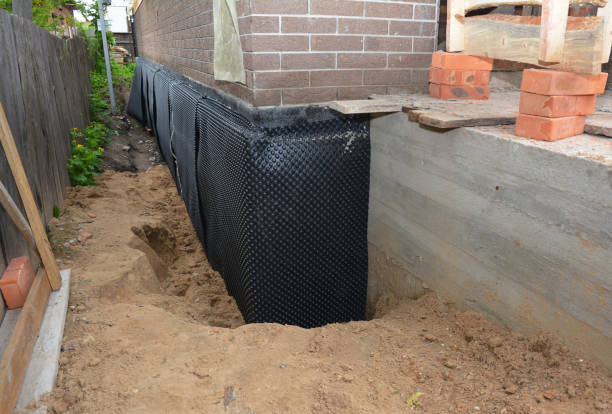 Happy homeowners after waterproofing job in Kings Park